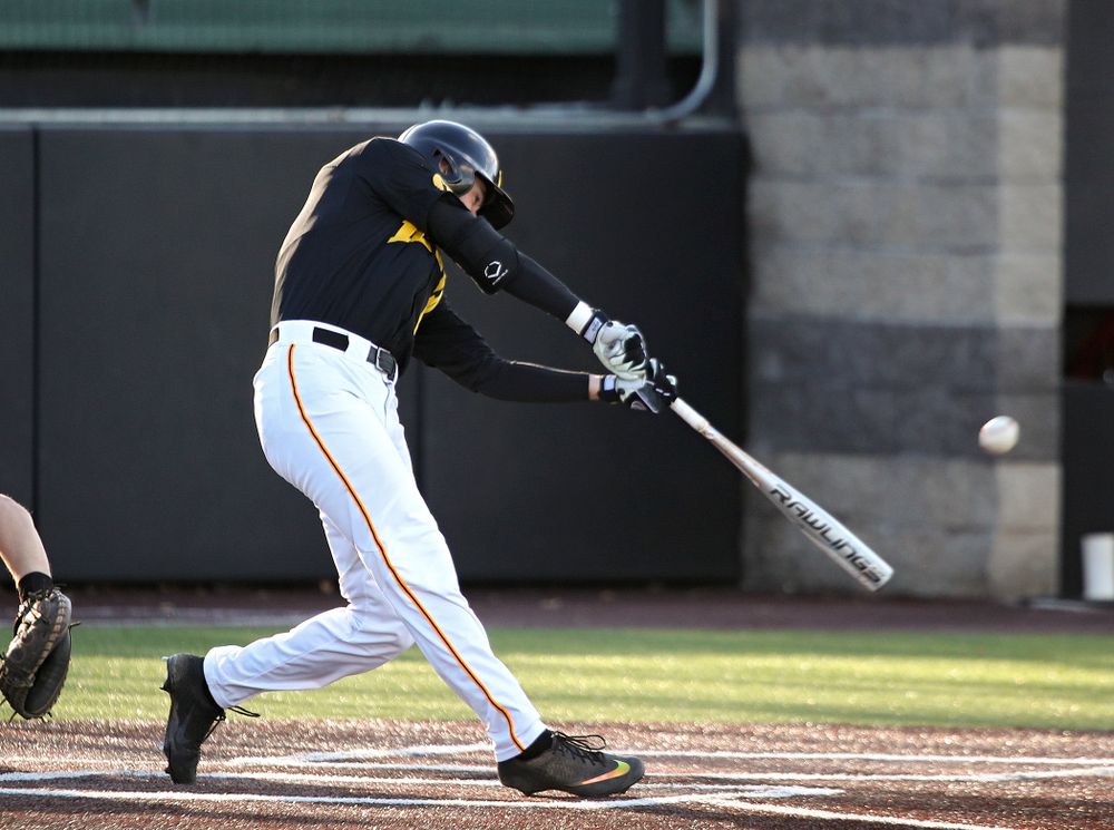 Iowa outfielder Ben Norman (9) drives a pitch for a hit during the first inning of their game at Duane Banks Field in Iowa City on Tuesday, March 3, 2020. (Stephen Mally/hawkeyesports.com)