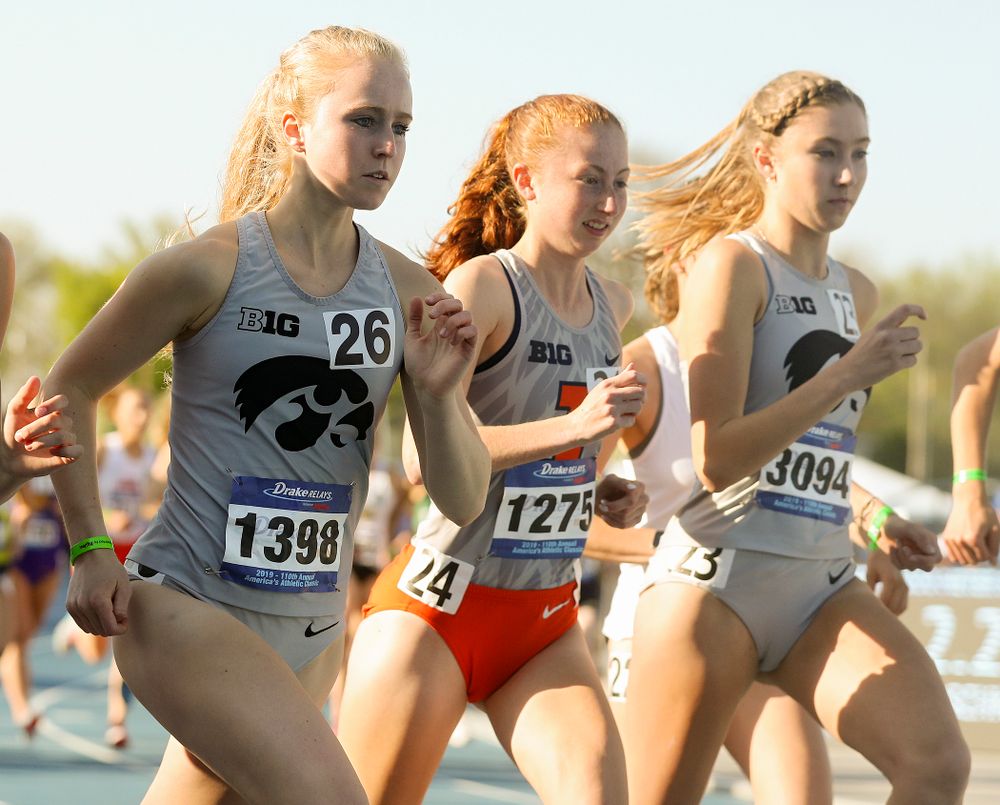Iowa's Kylie Latham (left) and Jessica McKee (right) run the women's 10,000 meter event during the first day of the Drake Relays at Drake Stadium in Des Moines on Thursday, Apr. 25, 2019. (Stephen Mally/hawkeyesports.com)