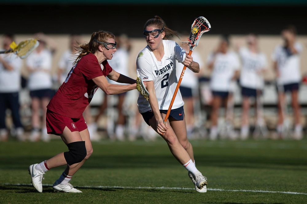 STANFORD, California - FEBRUARY 14: Virginia Cavaliers midfield Sammy Mueller (2) is defended by Stanford Cardinal midfield Jacie Lemos (33) during the first half at Cagan Stadium on February 14, 2020 in Stanford, California. The Virginia Cavaliers defeated the Stanford Cardinal 12-11. (Photo by Jason O. Watson)