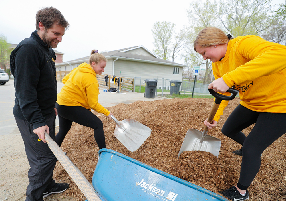 Iowa field hockey players re-mulch the playground at the HACAP Coral Ridge Head Start Center during the 21st annual ISAAC Hawkeye Day of Caring in Coralville on Sunday, Apr. 28, 2019. (Stephen Mally/hawkeyesports.com)