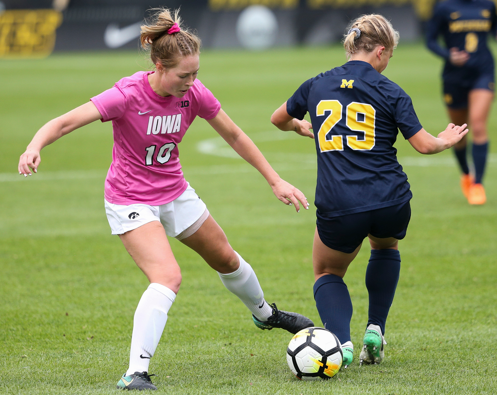 Iowa Hawkeyes midfielder Natalie Winters (10) makes a tackle during a game against Michigan at the Iowa Soccer Complex on October 14, 2018. (Tork Mason/hawkeyesports.com)