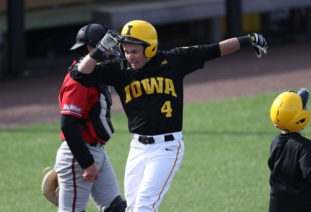 Iowa Hawkeyes infielder Mitchell Boe (4) reacts after hitting a game tying three-run homer against California State Northridge Sunday, March 17, 2019 at Duane Banks Field. (Brian Ray/hawkeyesports.com)