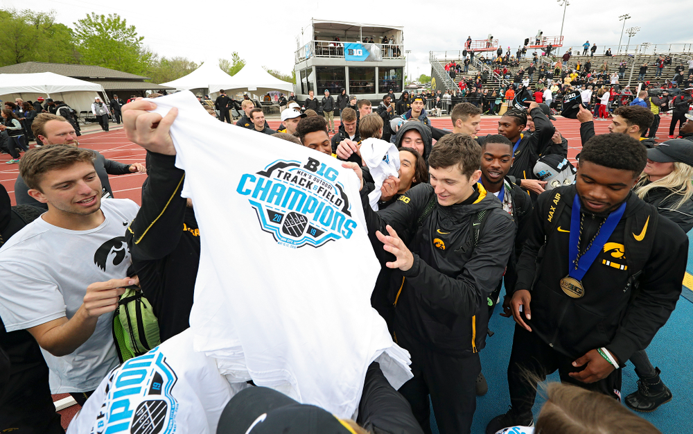 Championship shirts and hats are handed out to the Hawkeyes after winning the Men's Big Ten Outdoor Track and Field Championships on the third day of the Big Ten Outdoor Track and Field Championships at Francis X. Cretzmeyer Track in Iowa City on Sunday, May. 12, 2019. (Stephen Mally/hawkeyesports.com)