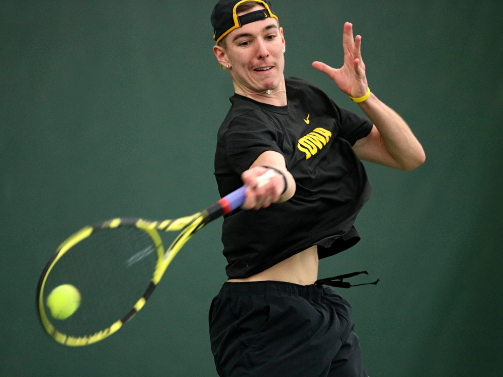 Iowa’s Nikita Snezhko returns a shot during his singles match at the Hawkeye Tennis and Recreation Complex in Iowa City on Friday, February 14, 2020. (Stephen Mally/hawkeyesports.com)