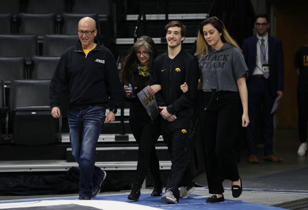Iowa Men's Gymnast Kevin Johnson and his family during senior day ceremonies following their meet against the Ohio State Buckeyes Saturday, March 16, 2019 at Carver-Hawkeye Arena. (Brian Ray/hawkeyesports.com)