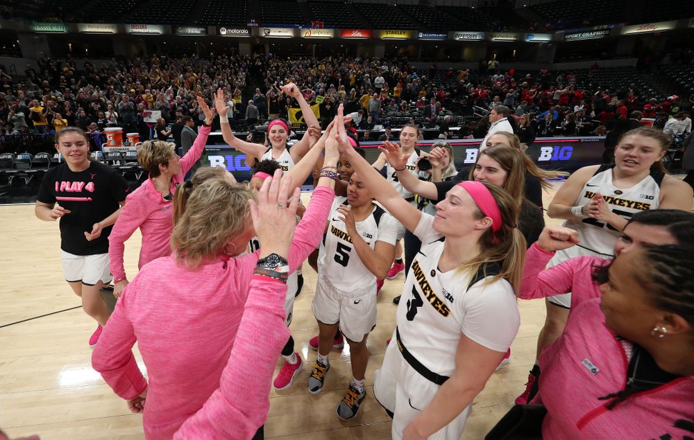 The Iowa Hawkeyes celebrate their win against the Rutgers Scarlet Knights in the semi-finals of the Big Ten Tournament Saturday, March 9, 2019 at Bankers Life Fieldhouse in Indianapolis, Ind. (Brian Ray/hawkeyesports.com)