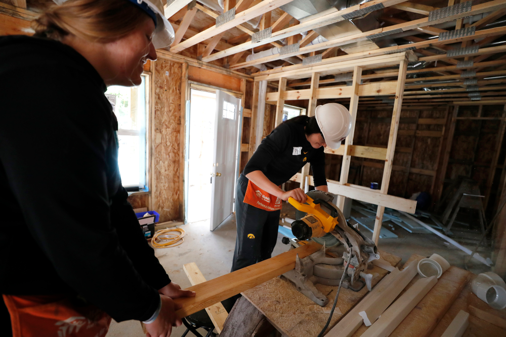 Iowa Hawkeyes forward Megan Gustafson (10) and Iowa Hawkeyes forward/center Monika Czinano (25) work on the Habitat for Humanity Women's Build Wednesday, September 26, 2018 in Iowa City. (Brian Ray/hawkeyesports.com)