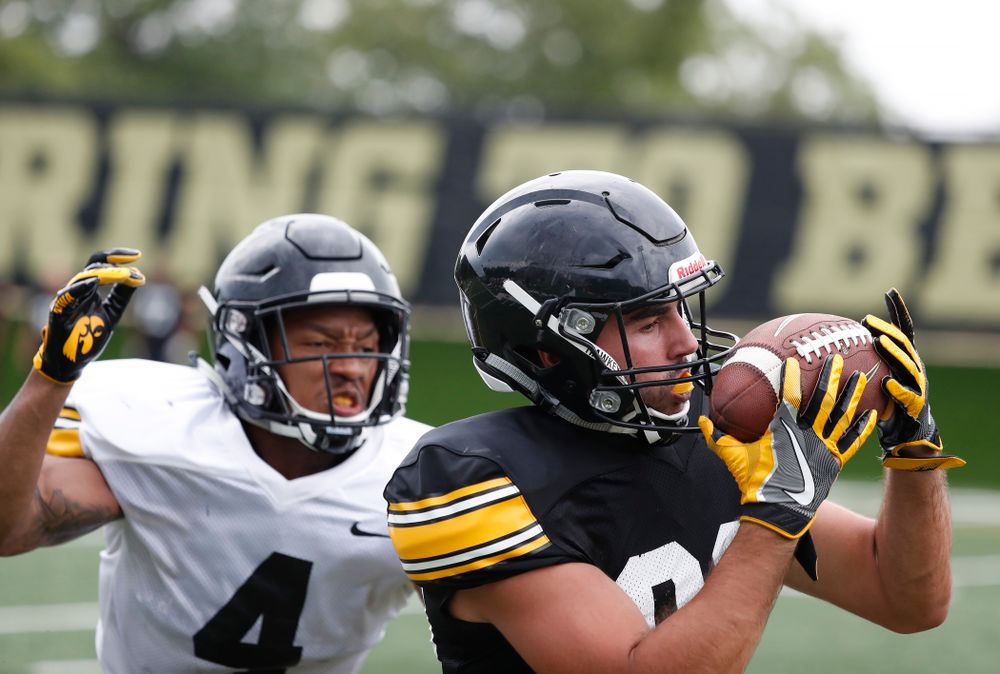 Iowa Hawkeyes wide receiver Nico Ragaini (89) and defensive back Josh Turner (4) during practice No. 4 of Fall Camp Monday, August 6, 2018 at the Hansen Football Performance Center. (Brian Ray/hawkeyesports.com)