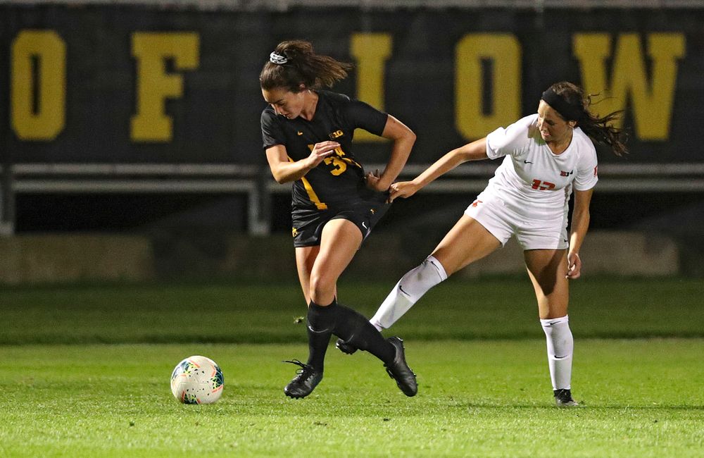 Iowa forward Devin Burns (30) tries to pull away from a defender during the first half of their match against Illinois at the Iowa Soccer Complex in Iowa City on Thursday, Sep 26, 2019. (Stephen Mally/hawkeyesports.com)