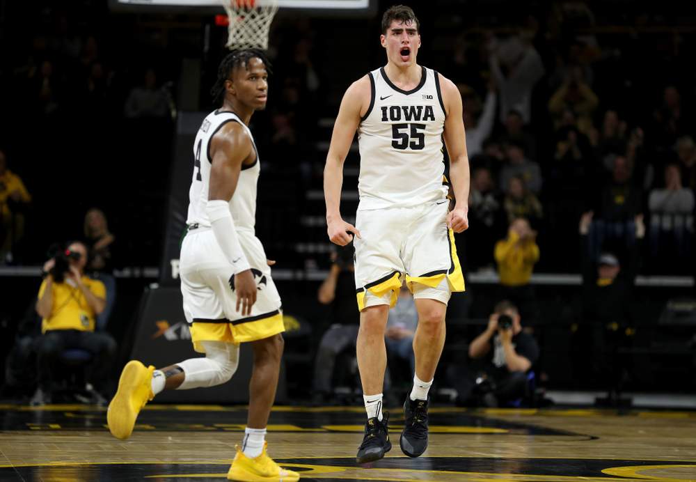 Iowa Hawkeyes forward Luka Garza (55) celebrates a three point basket against the Maryland Terrapins Friday, January 10, 2020 at Carver-Hawkeye Arena. (Brian Ray/hawkeyesports.com)