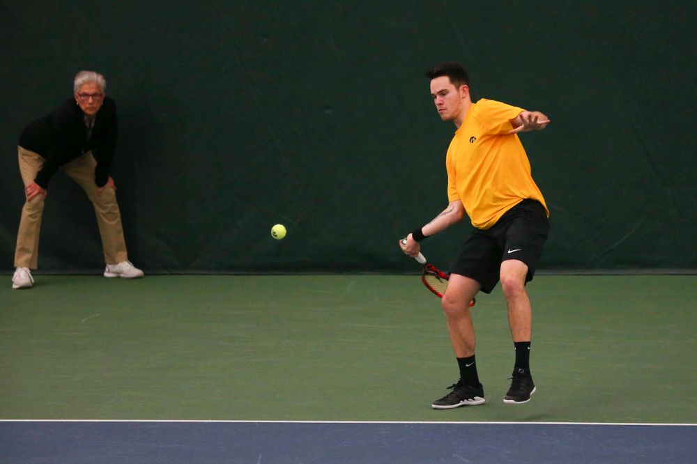Iowa's Jonas Larsen at a tennis match vs Drake Friday, March 8, 2019 at the Hawkeye Tennis and Recreation Complex. (Lily Smith/hawkeyesports.com)