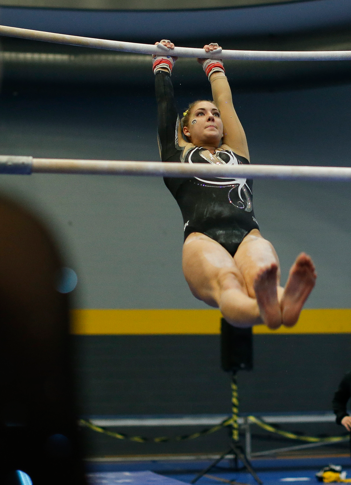 Emma Hartzler competes on the uneven bars during the Black and Gold Intrasquad meet at the Field House on 12/2/17. (Tork Mason/hawkeyesports.com)