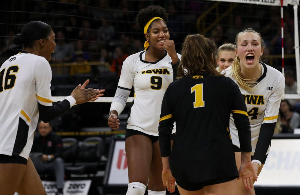 Iowa Hawkeyes middle blocker Amiya Jones (9) and Iowa Hawkeyes outside hitter Cali Hoye (14) celebrate after winning a point during a match against Rutgers at Carver-Hawkeye Arena on November 2, 2018. (Tork Mason/hawkeyesports.com)
