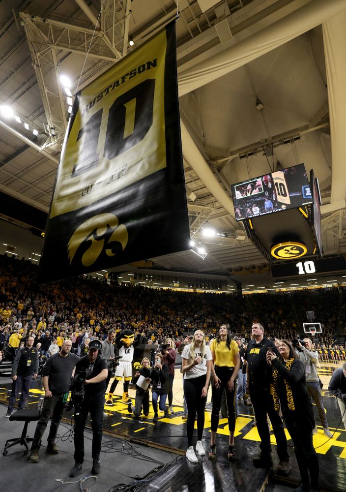 Megan Gustafson stands with her family as her number is raised into the rafters during a jersey retirement ceremony Sunday, January 26, 2020 at Carver-Hawkeye Arena. (Brian Ray/hawkeyesports.com)