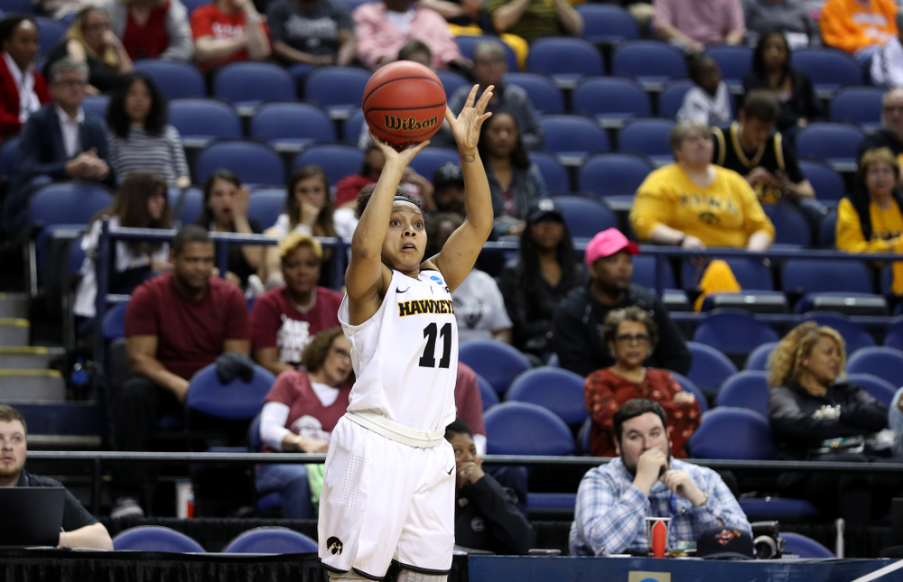 Iowa Hawkeyes guard Tania Davis (11) knocks down a three point basket against the NC State Wolfpack in the regional semi-final of the 2019 NCAA Women's College Basketball Tournament Saturday, March 30, 2019 at Greensboro Coliseum in Greensboro, NC.(Brian Ray/hawkeyesports.com)