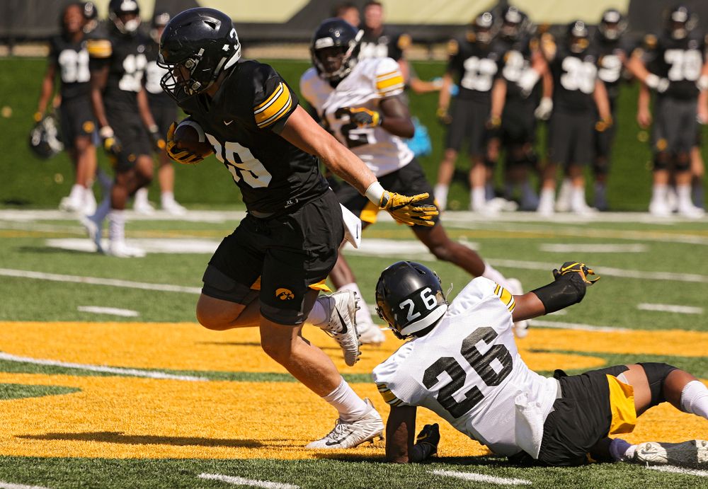 Iowa Hawkeyes tight end Nate Wieting (39) pulls away from defensive back Kaevon Merriweather (26) during Fall Camp Practice No. 7 at the Hansen Football Performance Center in Iowa City on Friday, Aug 9, 2019. (Stephen Mally/hawkeyesports.com)