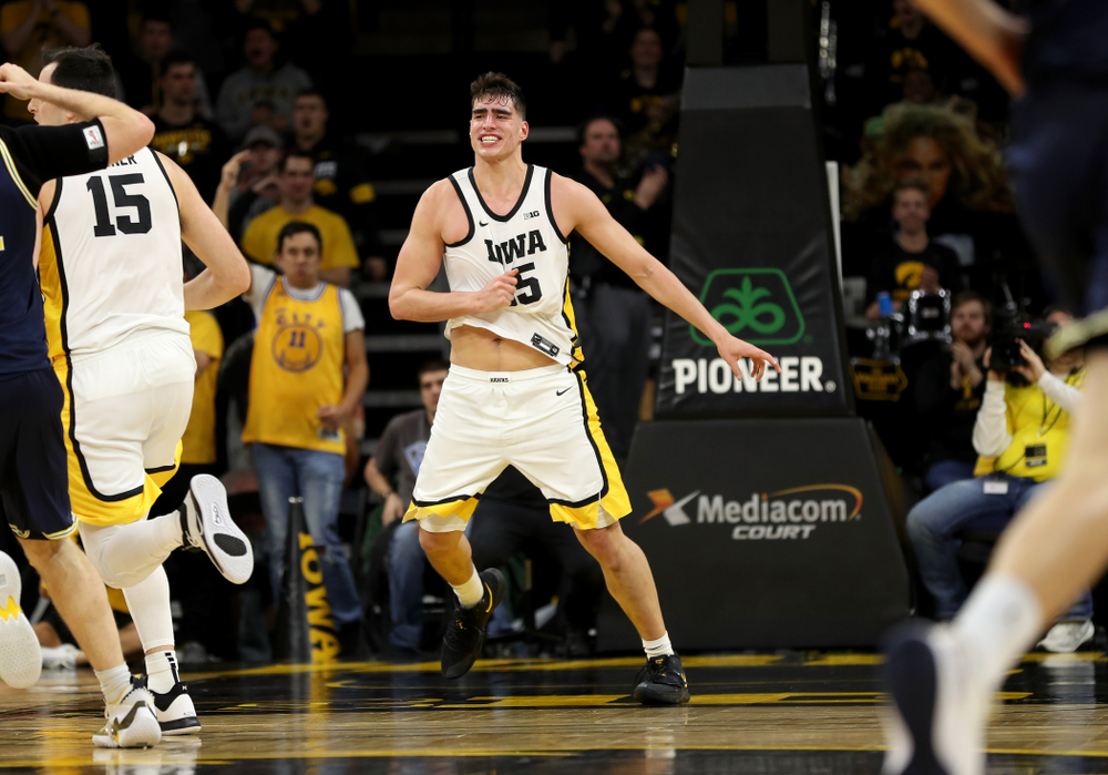 Iowa Hawkeyes forward Luka Garza (55) knocks down a shot against the Michigan Wolverines Friday, January 17, 2020 at Carver-Hawkeye Arena. (Brian Ray/hawkeyesports.com)