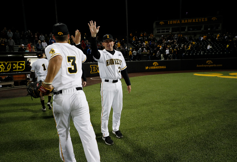 Iowa Hawkeyes head coach Rick Heller and infielder Matt Hoeg (3) against the Michigan Wolverines Friday, April 27, 2018 at Duane Banks Field in Iowa City. (Brian Ray/hawkeyesports.com)