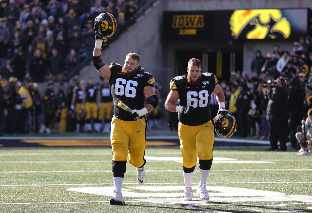 Iowa Hawkeyes offensive lineman Landan Paulsen (68) and offensive lineman Levi Paulsen (66) during Senior Day festivities before their game against the Illinois Fighting Illini Saturday, November 23, 2019 at Kinnick Stadium. (Brian Ray/hawkeyesports.com)