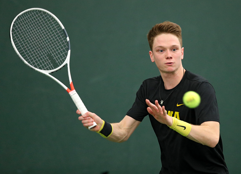 Iowa’s Jason Kerst returns a shot during his singles match at the Hawkeye Tennis and Recreation Complex in Iowa City on Friday, February 14, 2020. (Stephen Mally/hawkeyesports.com)