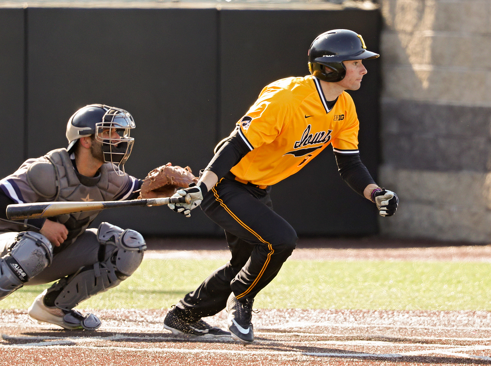 Iowa Hawkeyes center fielder Ben Norman (9) hits an RBI single during the first inning of their game at Duane Banks Field in Iowa City on Tuesday, Apr. 2, 2019. (Stephen Mally/hawkeyesports.com)