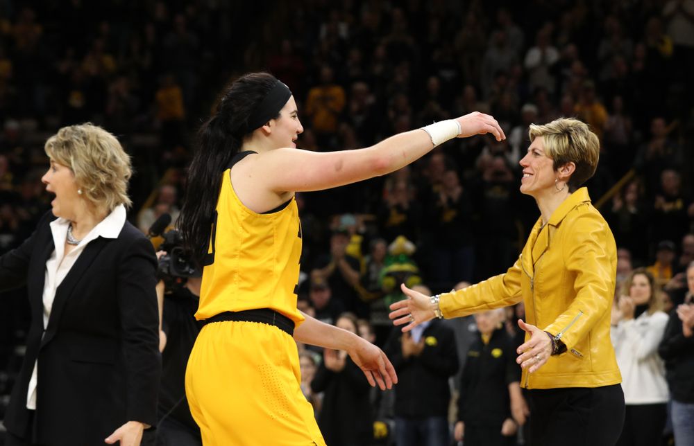 Iowa Hawkeyes forward Megan Gustafson (10) and associate head coach Jan Jensen during senior day ceremonies following their game against the Northwestern Wildcats Sunday, March 3, 2019 at Carver-Hawkeye Arena. (Brian Ray/hawkeyesports.com)