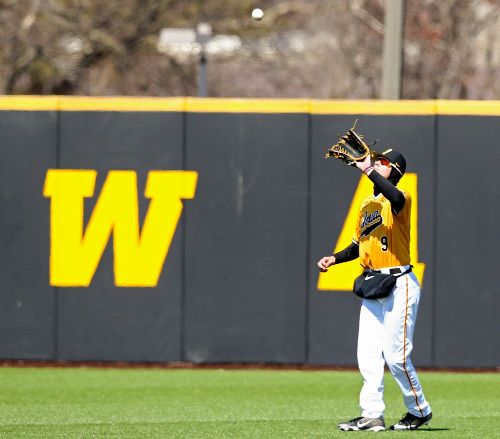 Iowa Hawkeyes center fielder Ben Norman (9) pulls in a fly ball for an out during the third inning against Illinois at Duane Banks Field in Iowa City on Sunday, Mar. 31, 2019. (Stephen Mally/hawkeyesports.com)