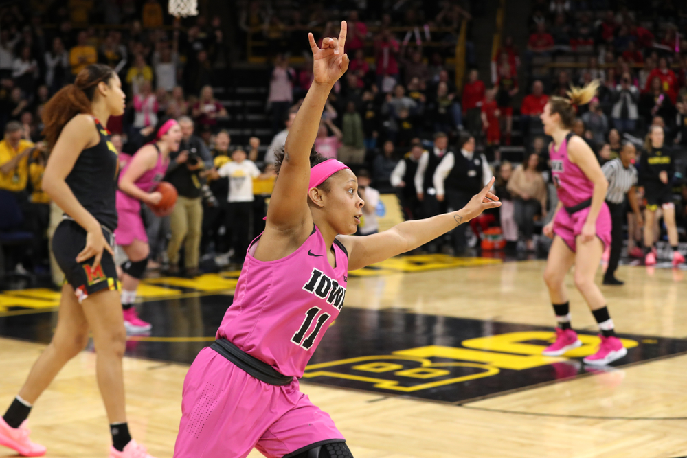 Iowa Hawkeyes guard Tania Davis (11) celebrates their victory against the seventh ranked Maryland Terrapins Sunday, February 17, 2019 at Carver-Hawkeye Arena. (Brian Ray/hawkeyesports.com)