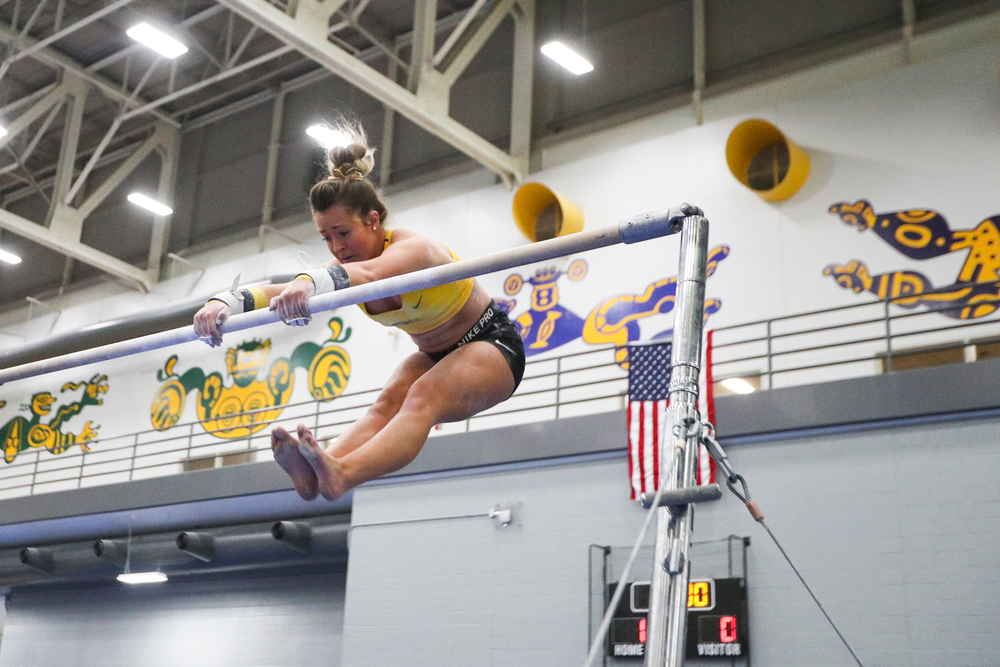 Maddie Kampschroeder performs on the uneven bars during the Iowa women’s gymnastics Black and Gold Intraquad Meet on Saturday, December 7, 2019 at the UI Field House. (Lily Smith/hawkeyesports.com)