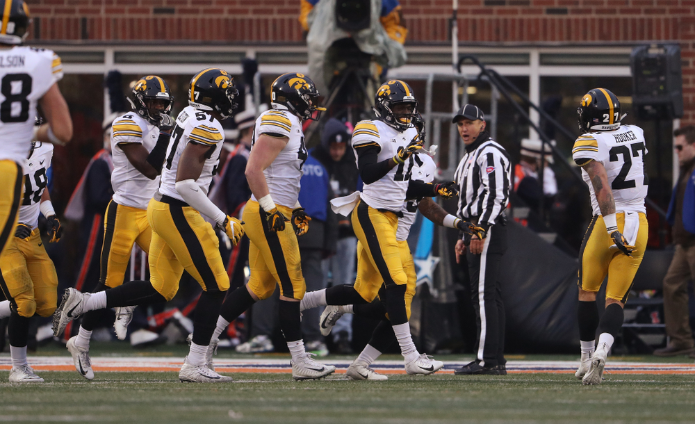 Iowa Hawkeyes defensive back Michael Ojemudia (11) celebrates after intercepting a pass against the Illinois Fighting Illini Saturday, November 17, 2018 at Memorial Stadium in Champaign, Ill. (Brian Ray/hawkeyesports.com)