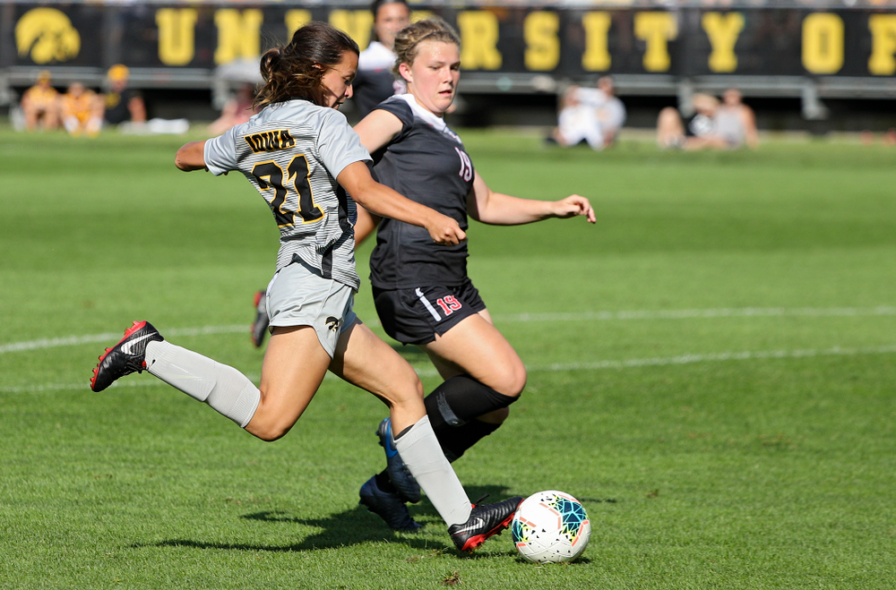 Iowa forward Emma Tokuyama (21) scores a goal during the second half of their match at the Iowa Soccer Complex in Iowa City on Sunday, Sep 1, 2019. (Stephen Mally/hawkeyesports.com)
