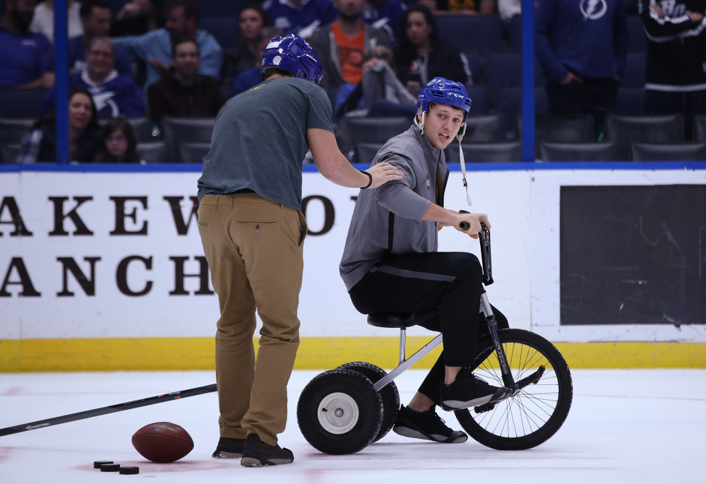 Iowa Hawkeyes quarterback Nate Stanley (4) and tight end T.J. Hockenson (38) during a contest against Mississippi State during the first intermission of the Tampa Bay Lightning game Thursday, December 27, 2018 at Amalie Arena. (Brian Ray/hawkeyesports.com)