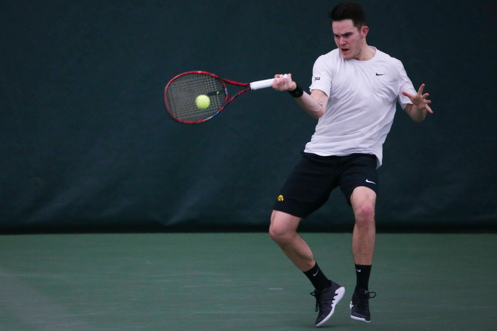 Iowa's Jonas Larsen at a tennis match vs Drake Friday, March 8, 2019 at the Hawkeye Tennis and Recreation Complex. (Lily Smith/hawkeyesports.com)