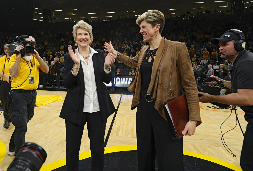 Iowa Hawkeyes head coach Lisa Bluder and associate head coach Jan Jensen after winning their game at Carver-Hawkeye Arena in Iowa City on Thursday, January 23, 2020. (Stephen Mally/hawkeyesports.com)