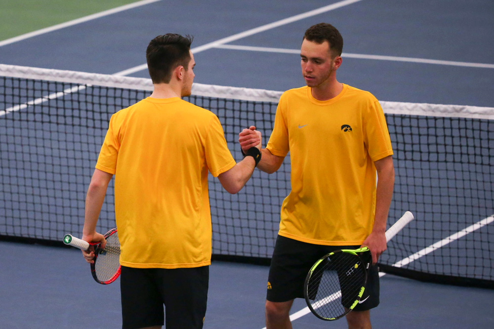Iowa's Kareem Allaf (right) and Jonas Larsen (left) at a tennis match vs Drake Friday, March 8, 2019 at the Hawkeye Tennis and Recreation Complex. (Lily Smith/hawkeyesports.com)