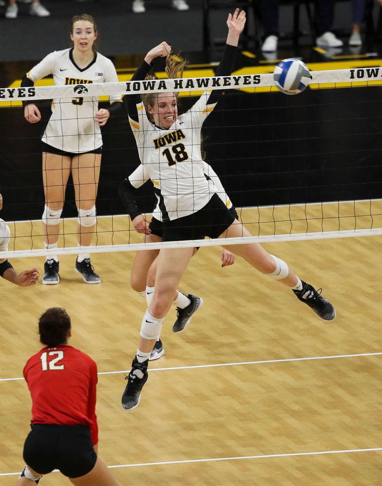Iowa Hawkeyes middle blocker Hannah Clayton (18) goes up for a block during a match against Maryland at Carver-Hawkeye Arena on November 23, 2018. (Tork Mason/hawkeyesports.com)