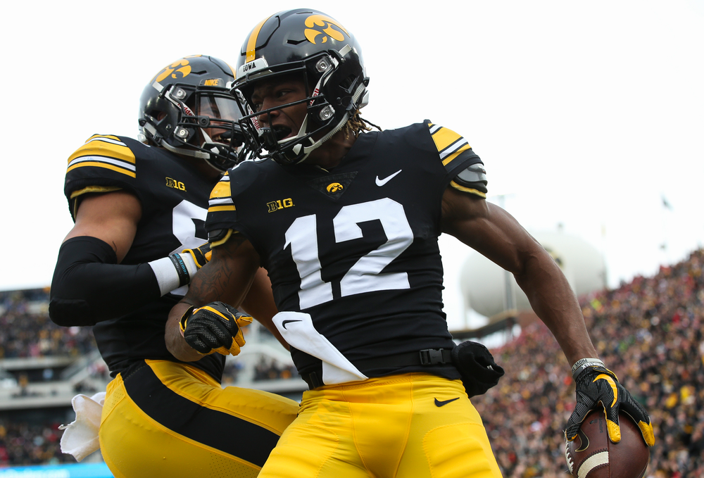 Iowa Hawkeyes wide receiver Brandon Smith (12) celebrates after scoring a touchdown during a game against Nebraska at Kinnick Stadium on November 23, 2018. (Tork Mason/hawkeyesports.com)