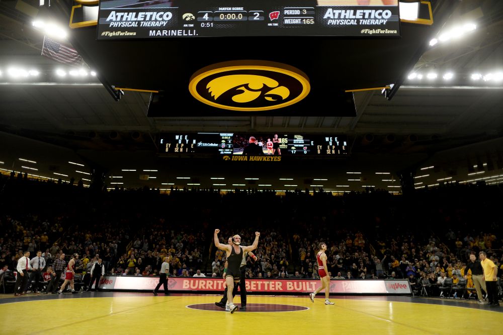 IowaÕs Alex Marinelli wrestles WisconsinÕs Evan Wick at 165 pounds Sunday, December 1, 2019 at Carver-Hawkeye Arena. Marinelli won the match 4-2. (Brian Ray/hawkeyesports.com)