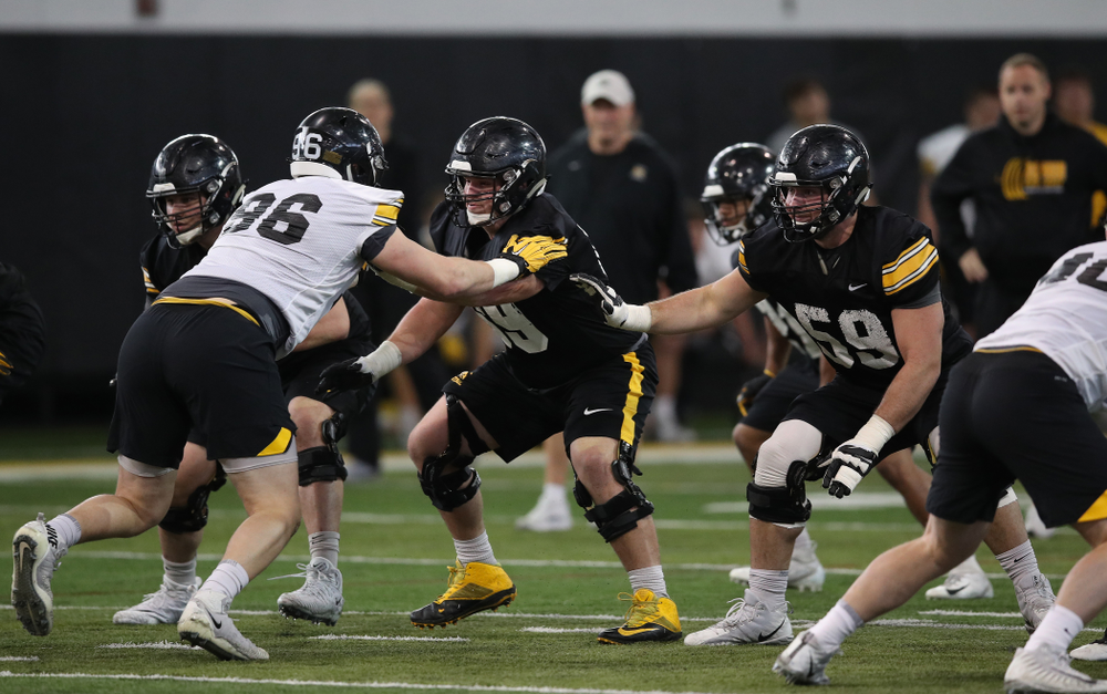 Iowa Hawkeyes offensive lineman Keegan Render (69) and offensive lineman Ross Reynolds (59) during preparation for the 2019 Outback Bowl Tuesday, December 18, 2018 at the Hansen Football Performance Center. (Brian Ray/hawkeyesports.com)