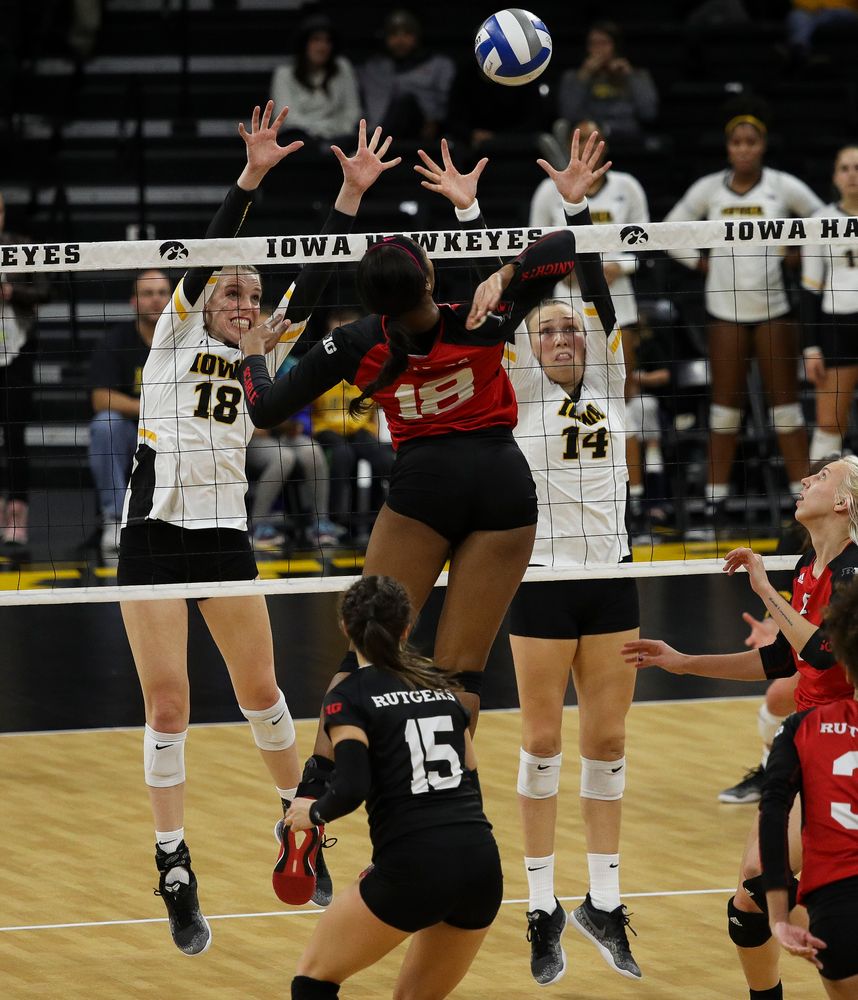 Iowa Hawkeyes middle blocker Hannah Clayton (18) and Iowa Hawkeyes outside hitter Cali Hoye (14) go up for a block during a match against Rutgers at Carver-Hawkeye Arena on November 2, 2018. (Tork Mason/hawkeyesports.com)