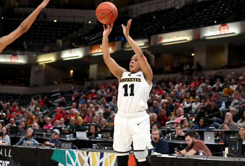 Iowa Hawkeyes guard Tania Davis (11) knocks down a three point basket against the Rutgers Scarlet Knights in the semi-finals of the Big Ten Tournament Saturday, March 9, 2019 at Bankers Life Fieldhouse in Indianapolis, Ind. (Brian Ray/hawkeyesports.com)