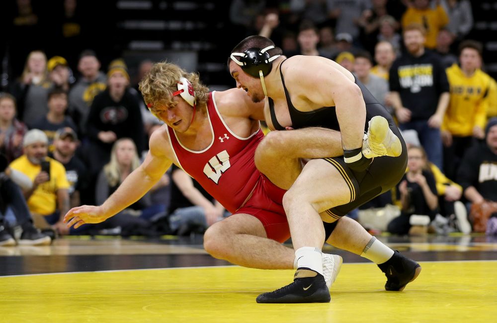 IowaÕs Tony Cassioppi wrestles WisconsinÕs Trent Hillger at heavyweight Sunday, December 1, 2019 at Carver-Hawkeye Arena. Cassioppi won the match 3-2. (Brian Ray/hawkeyesports.com)