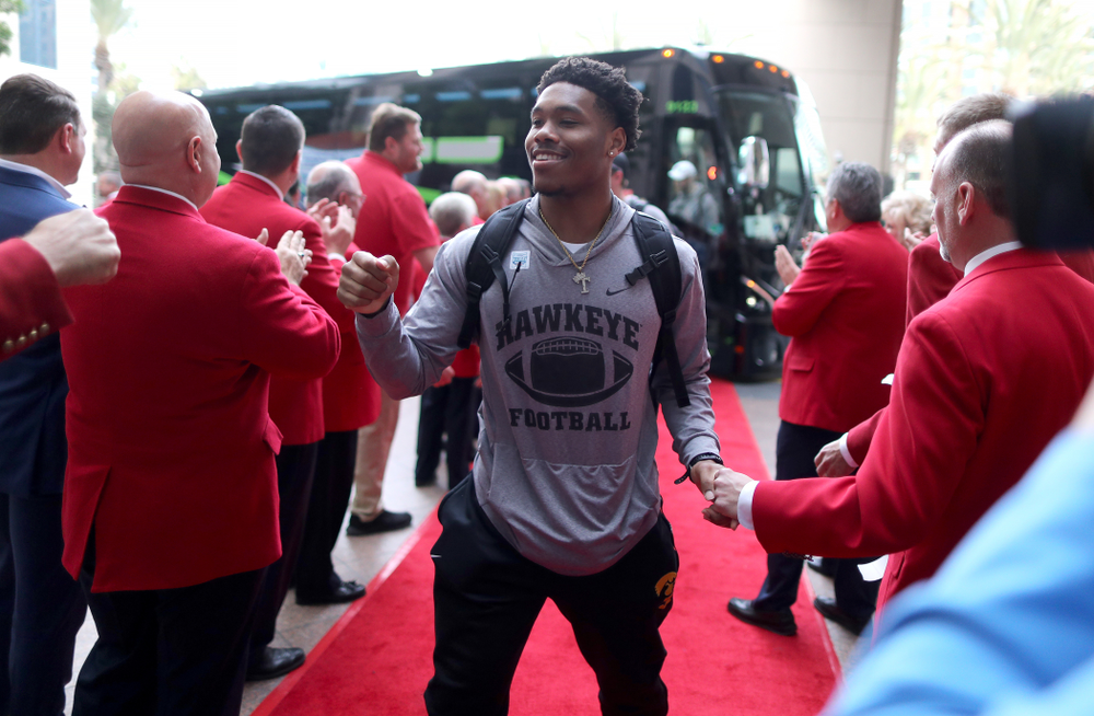 Iowa Hawkeyes wide receiver Tyrone Tracy Jr. (3) shakes hands with the ÒRed CoatsÓ after arriving in San Diego, CA Saturday, December 21, 2019 for the Holiday Bowl. (Brian Ray/hawkeyesports.com)