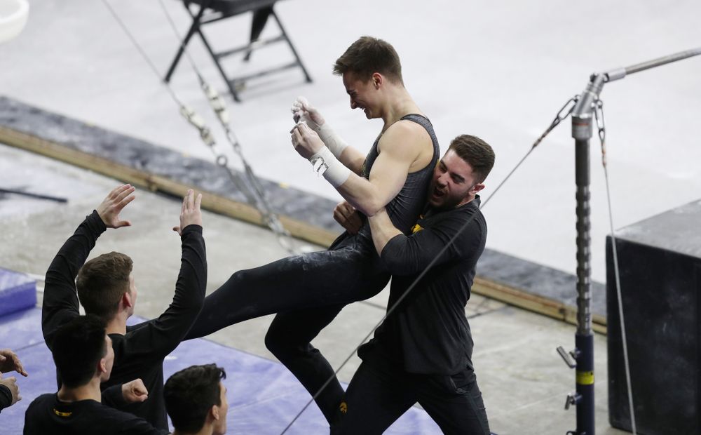 Iowa's Mitch Mandozzi competes on the high bar against Oklahoma Saturday, February 9, 2019 at Carver-Hawkeye Arena. (Brian Ray/hawkeyesports.com)