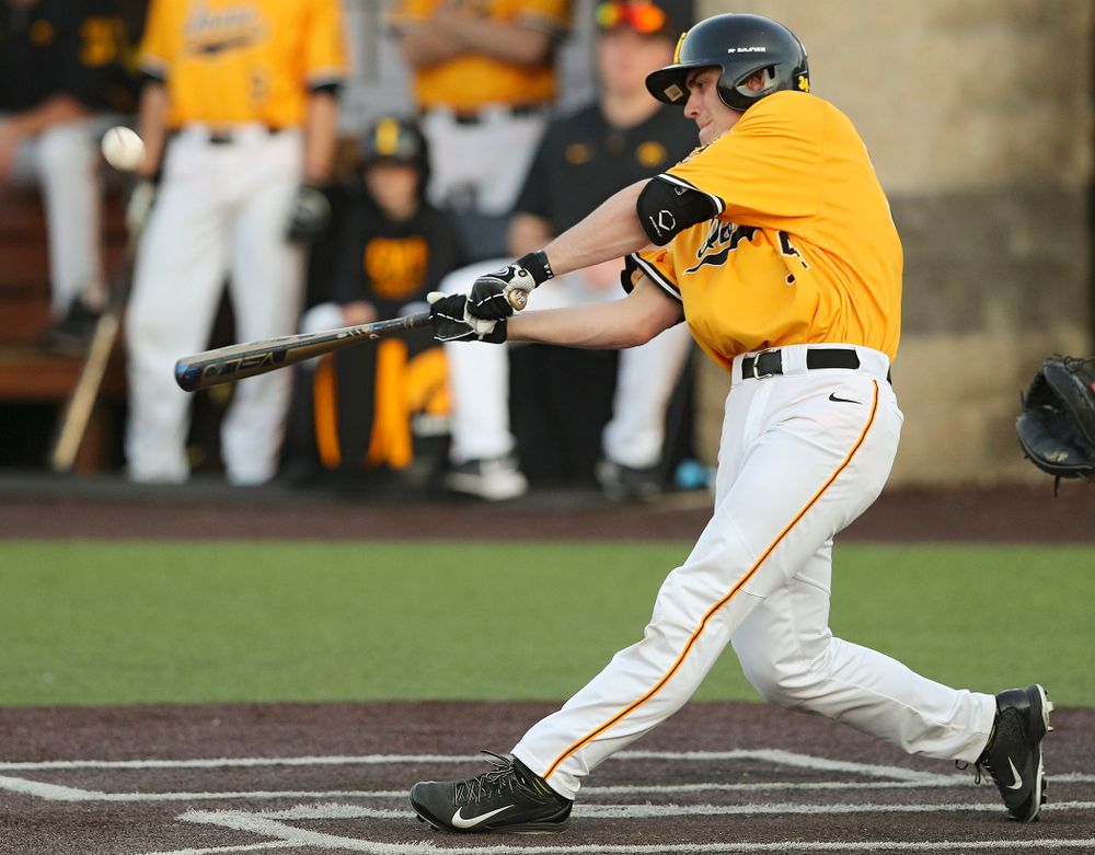 Iowa Hawkeyes designated hitter Austin Martin (34) hits an RBI single during the eighth inning of their game against Northern Illinois at Duane Banks Field in Iowa City on Tuesday, Apr. 16, 2019. (Stephen Mally/hawkeyesports.com)