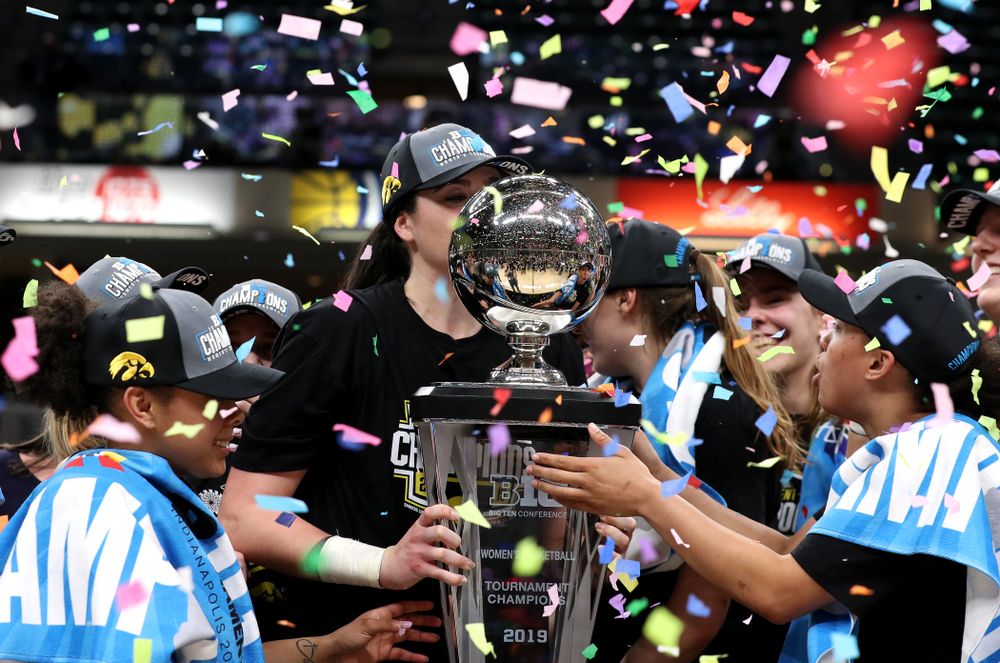 Iowa Hawkeyes forward Megan Gustafson (10) kisses the trophy as they celebrate their victory over the Maryland Terrapins in the Big Ten Championship Game Sunday, March 10, 2019 at Bankers Life Fieldhouse in Indianapolis, Ind. (Brian Ray/hawkeyesports.com)