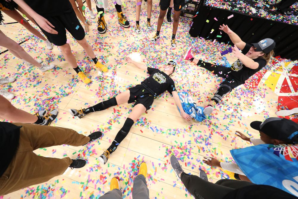 Iowa Hawkeyes forward Hannah Stewart (21) and guard Makenzie Meyer (3) celebrate their victory over the Maryland Terrapins in the Big Ten Championship Game Sunday, March 10, 2019 at Bankers Life Fieldhouse in Indianapolis, Ind. (Brian Ray/hawkeyesports.com)