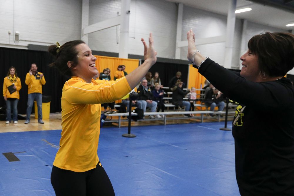 Gina Leal high fives assistant coach Jennifer Green before the Iowa women’s gymnastics Black and Gold Intraquad Meet on Saturday, December 7, 2019 at the UI Field House. (Lily Smith/hawkeyesports.com)