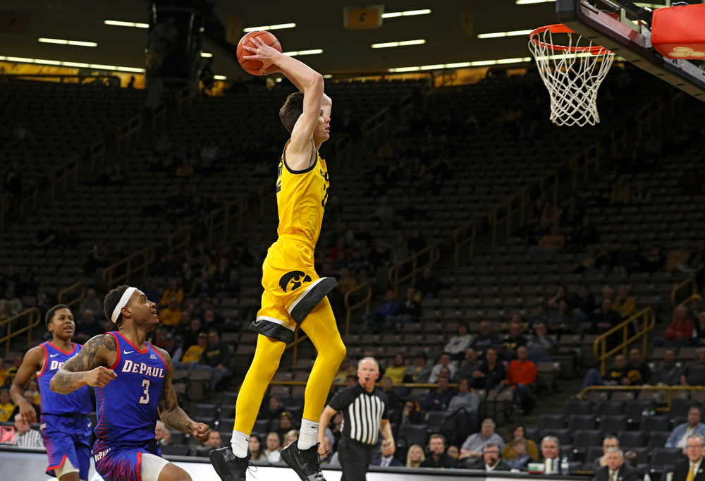 Iowa Hawkeyes forward Patrick McCaffery (22) dunks the ball during the second half of their game at Carver-Hawkeye Arena in Iowa City on Monday, Nov 11, 2019. (Stephen Mally/hawkeyesports.com)
