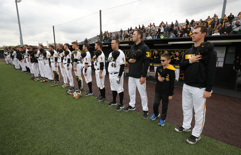 Garret Nichols stands with the rest of the team for the National Anthem before the Iowa Hawkeyes game against Michigan State Sunday, May 12, 2019 at Duane Banks Field. (Brian Ray/hawkeyesports.com)